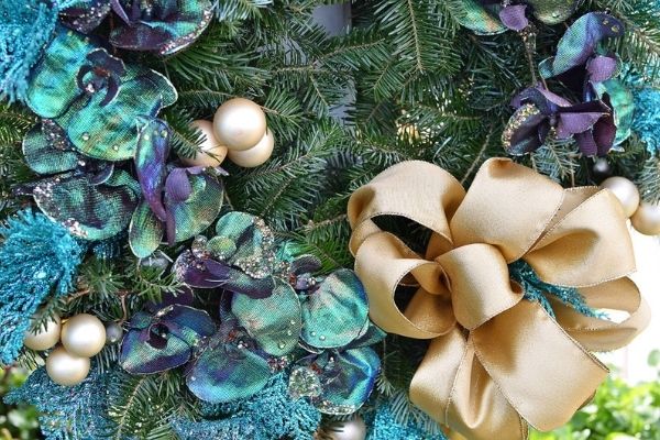 blue and gold ribbons on wreath