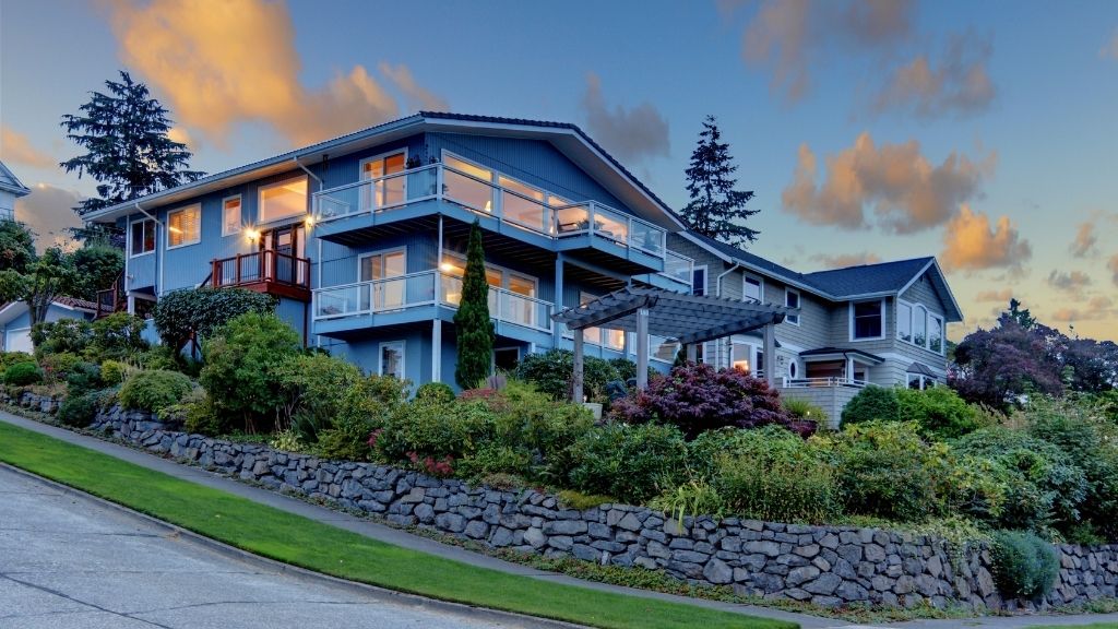 foundation plants need to work year round tucking house into hill