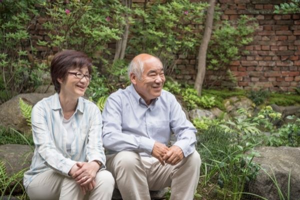 happy couple smiling in garden