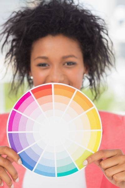 woman holding a color wheel