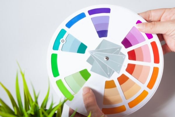 hands holding a color wheel